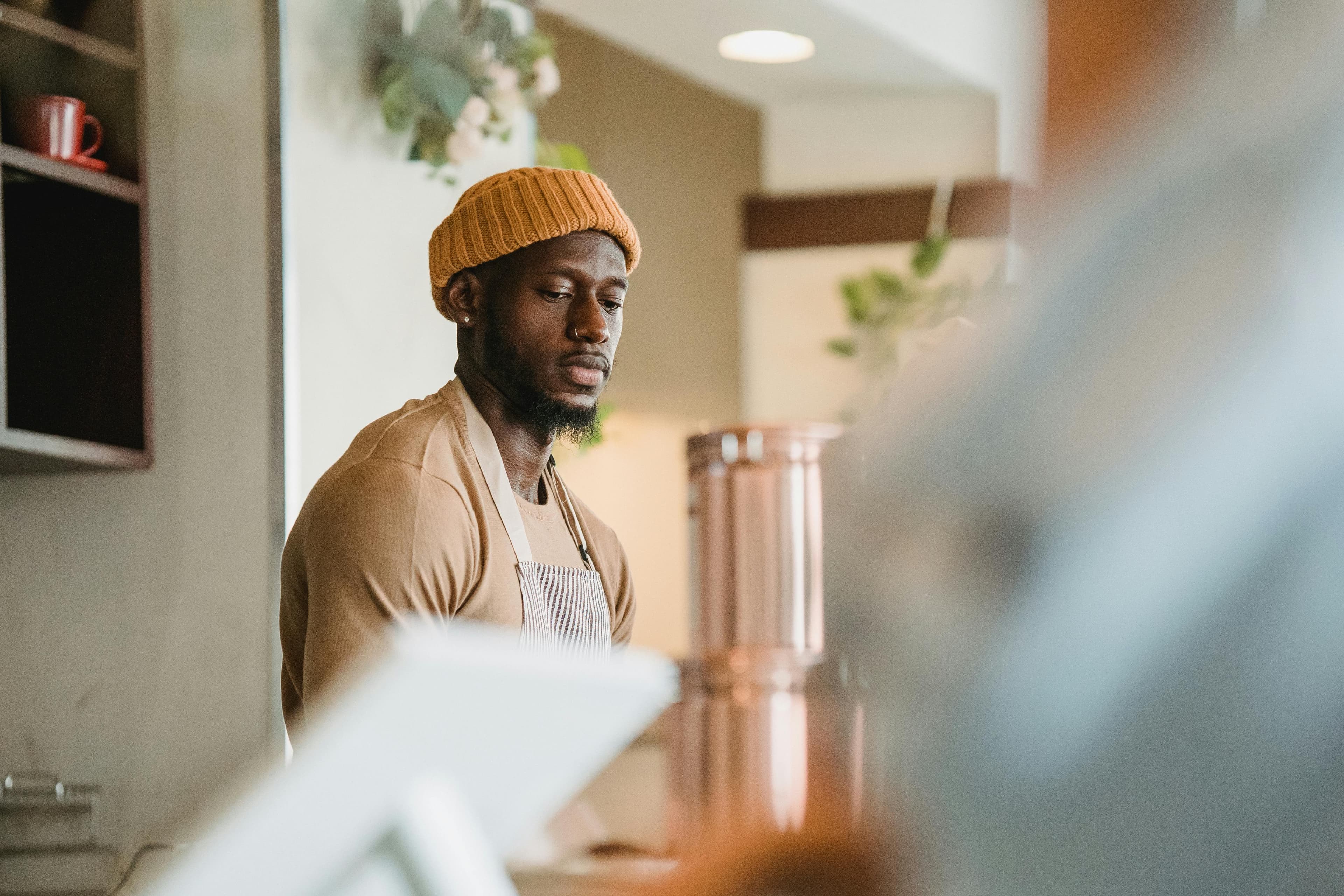 Man working orange beanie